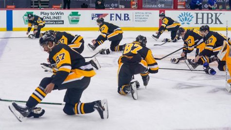 The Penguins players celebrate captain Sidney Crosbys 1,000th NHL game  by all wearing #87 jerseys and mimicking his skate tying routine.