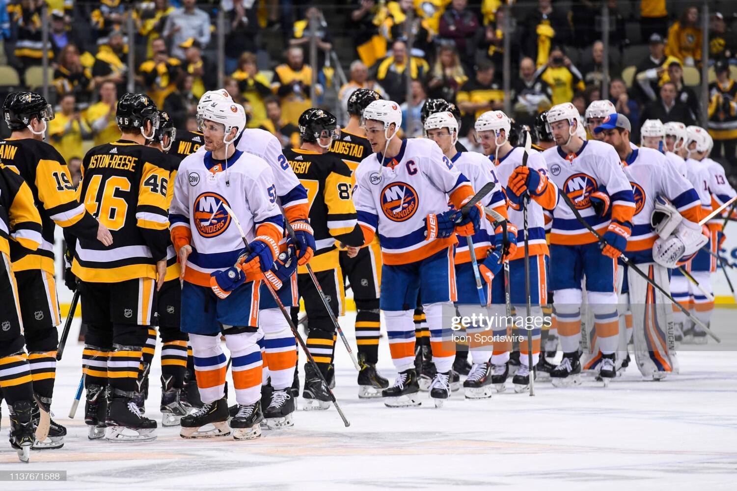 PITTSBURGH, PA - APRIL 16: The New York Islanders and  Pittsburgh Penguins shake hands at the end Game 4 in the First Round of the 2019 NHL Stanley Cup Playoffs between the New York Islanders and the Pittsburgh Penguins on April 16, 2019, at PPG Paints Arena in Pittsburgh, PA. The New York Islanders won the series 4-0. (Photo by Jeanine Leech/Icon Sportswire via Getty Images)