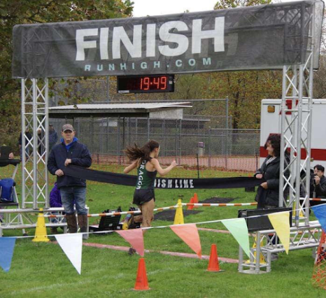 Ruthie Haworth crossing the finish line, earning her first place in PIAA District 10 championships. 