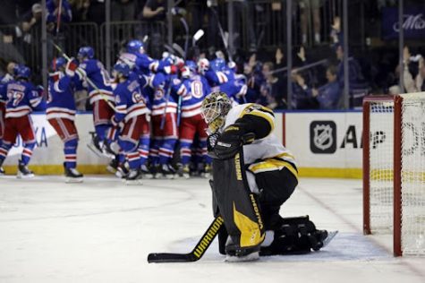 Tristan Jarry looks in dismay as the Rangers celebrate Artemi Panarin’s series winning overtime goal at Madison Square Garden.