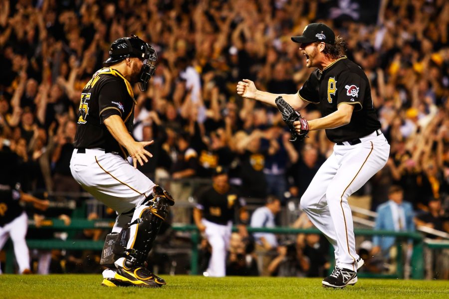 Pirates catcher Russell Martin (left) and pitcher Jason Grilli (right) run for a hug as the Pirates defeat the Cincinnati Reds 6-2 for their first postseason win in decades. Photo Credit: Justin K. Aller / Getty Images