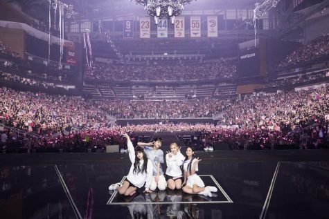 From left to right: Lisa, Jisoo, Rosé, and Jennie pose for a photo with the sold-out crowd in the background at State Farm Arena in Atlanta, GA. 