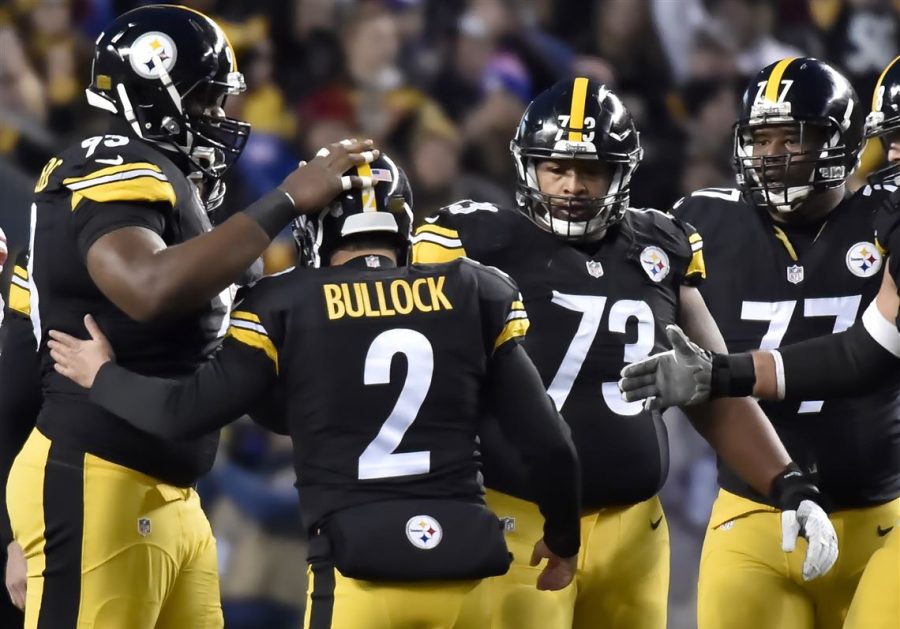 Steelers teammates congratulate Randy Bullock during a game. Photo Credit: Matt Freed